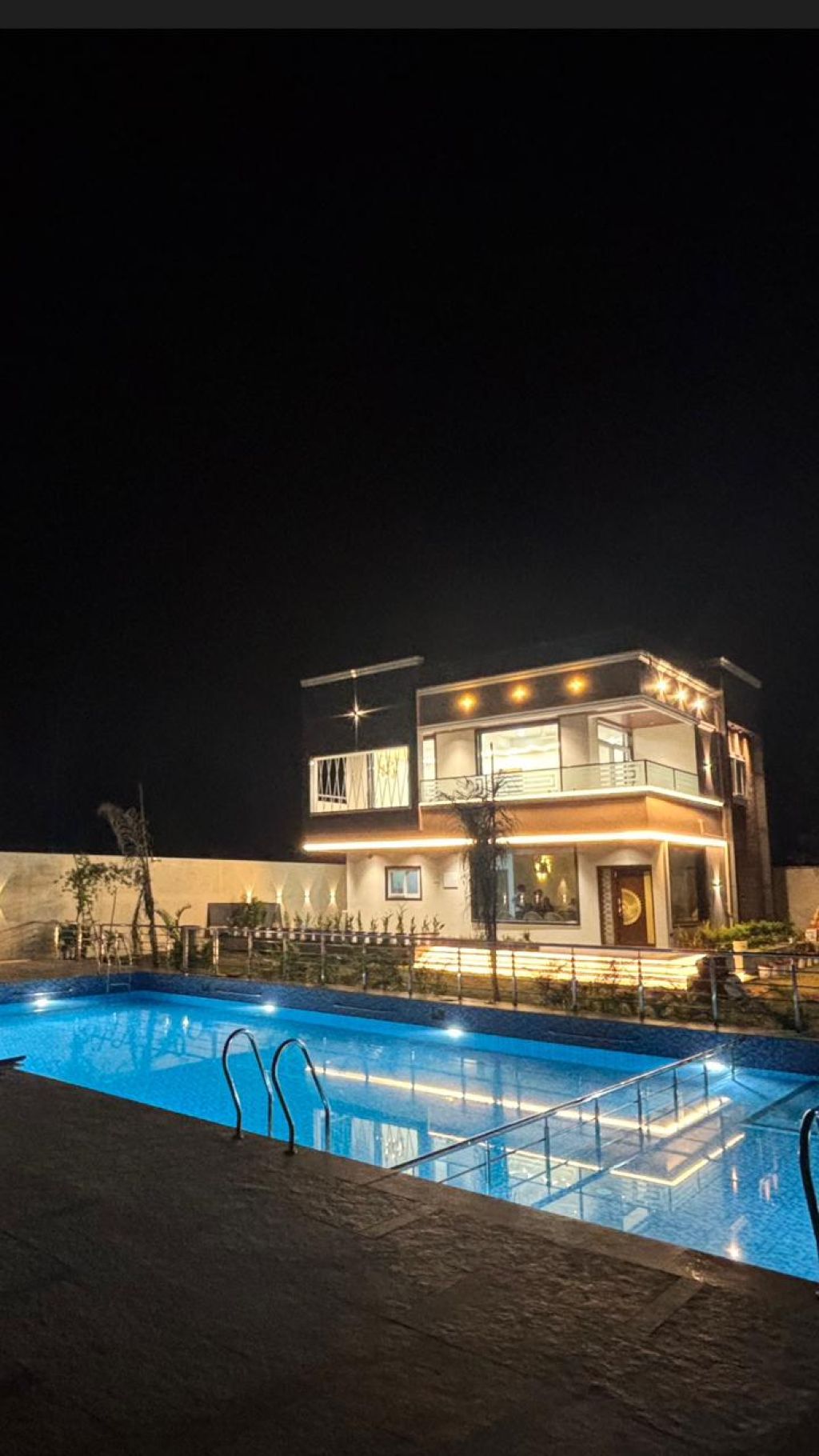 The farmhouse at night at Brown Farm Retreat, Bakaram, Moinabad